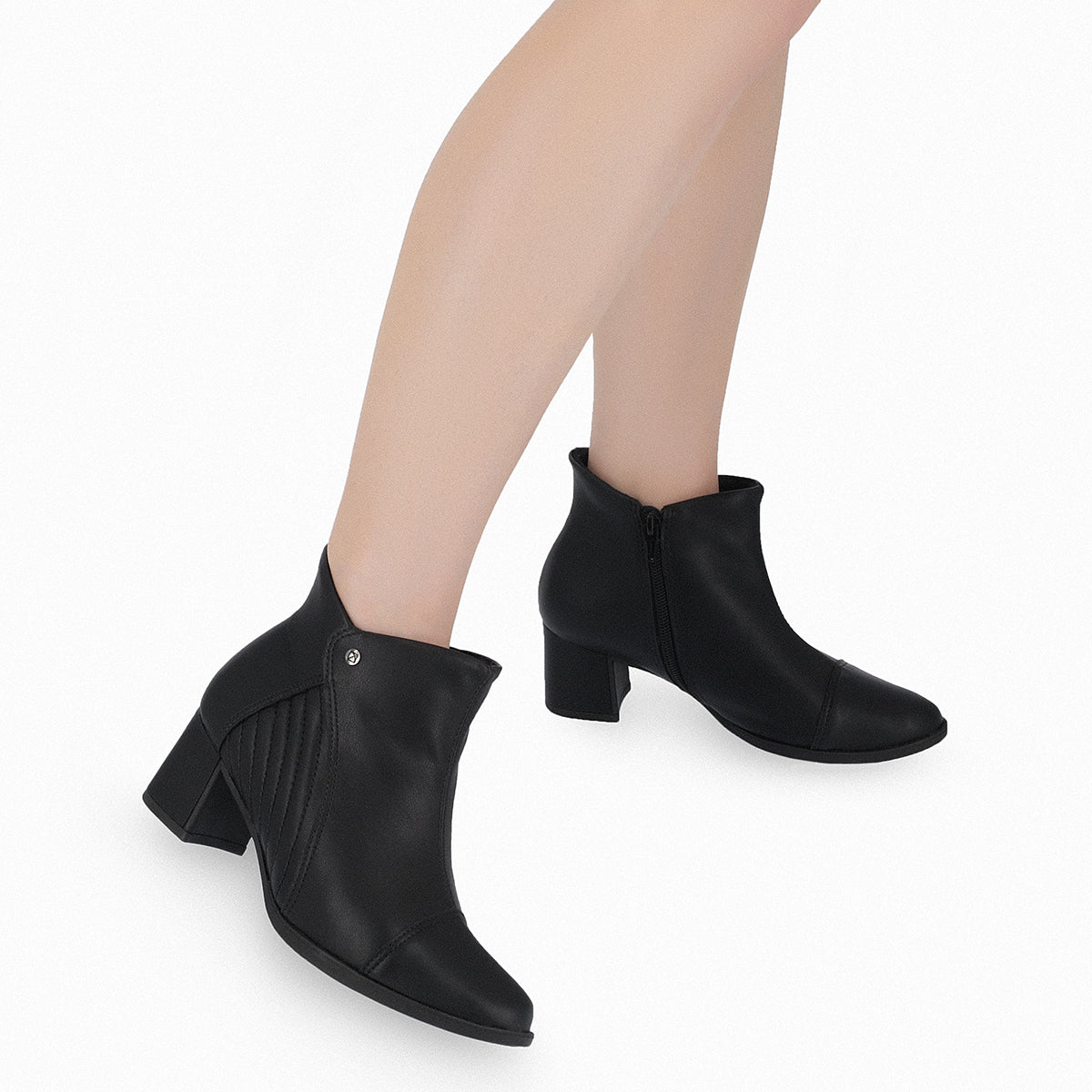 Botín para mujer tacón medio 5 cm con costuras laterales color negro cierre lateral sofisticadas