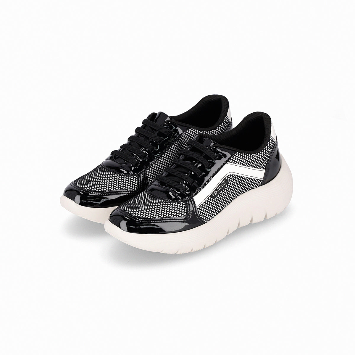 Par de tenis color blanco y negro casuales para mujer, colección Eliane, cuña media 3.5 cm. Estilo casual y cómodo con amortiguación, suela flexible y diseño versátil.