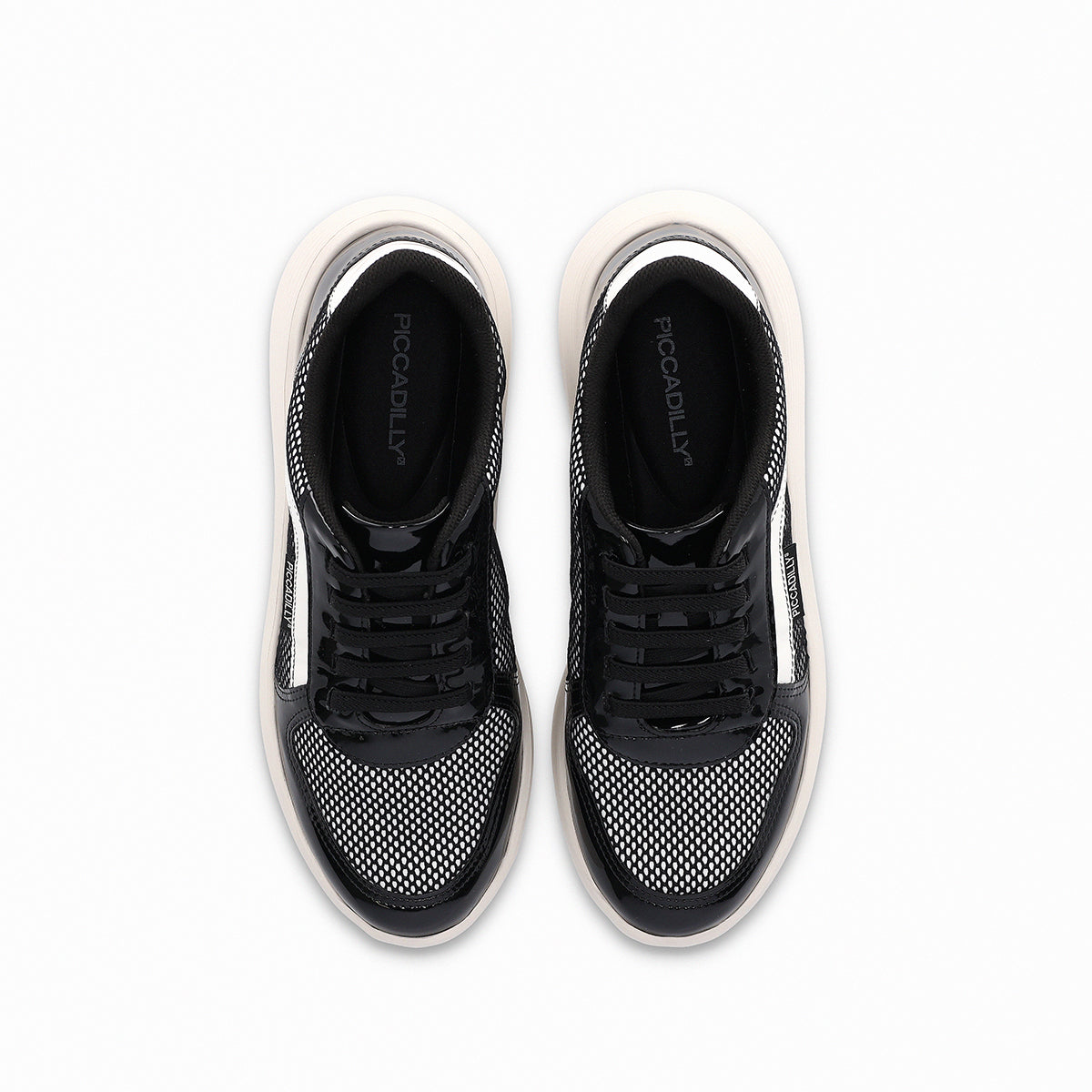 Tenis color blanco y negro casuales para mujer, colección Eliane, cuña media 3.5 cm. Vista desde arriba. Estilo casual y cómodo con amortiguación, suela flexible y diseño versátil.